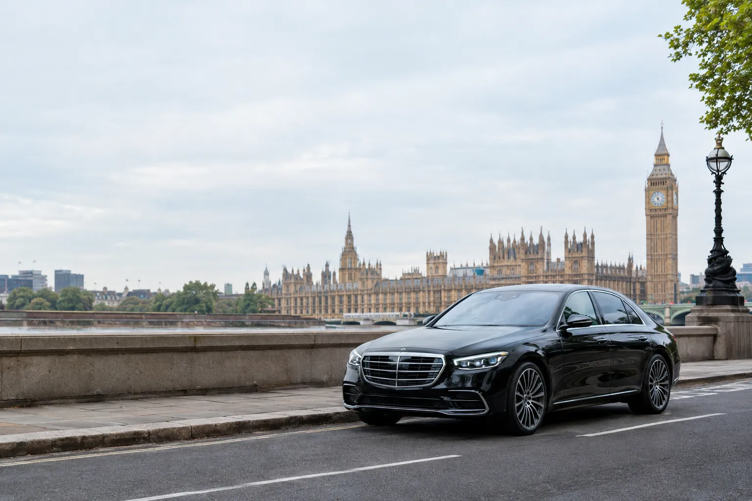 Black chauffeur saloon on a central London street with the Elizabeth Tower in the distance